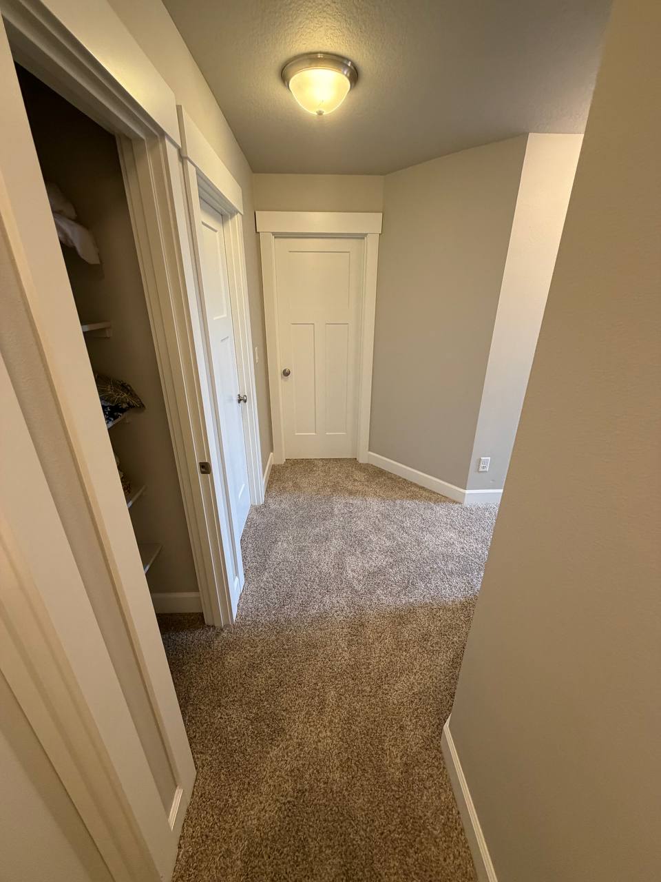 Hallway restored with new carpet and finished walls